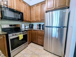 Kitchen with Stainless Steel Fridge - 