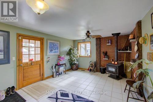 Entry from Deck  into Family Room with wood Stove - 713630 Durham Road B, Grey Highlands, ON 