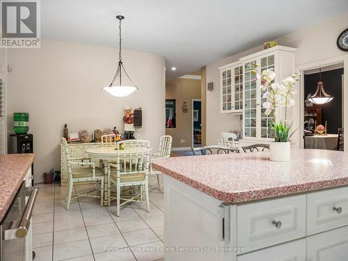 Granite Counters and  Breakfast Bar - 47 Fox Run Drive, Puslinch, ON - Indoor Photo Showing Dining Room