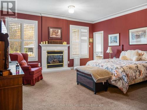 Primary Bedroom - 47 Fox Run Drive, Puslinch, ON - Indoor Photo Showing Bedroom With Fireplace