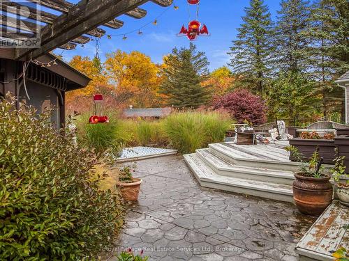 Deck and view of pool and Woods beyong - 47 Fox Run Drive, Puslinch, ON - Outdoor With Deck Patio Veranda