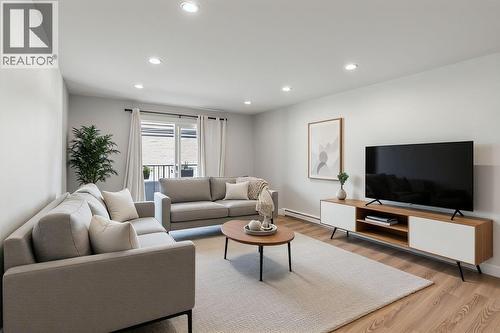 Living room is virtually staged - 4101 Alexis Park Drive Unit# 103, Vernon, BC - Indoor Photo Showing Living Room