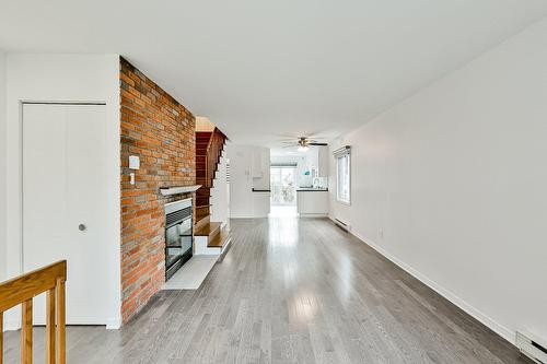 Salon - 319  - 321 Rue Blainville E., Sainte-Thérèse, QC - Indoor Photo Showing Other Room With Fireplace