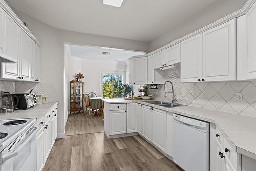 203-1940 Richter Street, Kelowna, BC - Indoor Photo Showing Kitchen With Double Sink