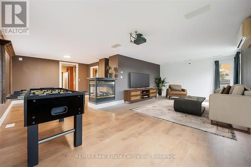 Photo has been virtually staged - 500 Watson Parkway S, Guelph (York/Watson Industrial Park), ON - Indoor With Fireplace