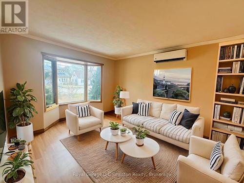 Virtually staged living room - 665 7Th Street E, Owen Sound, ON - Indoor Photo Showing Living Room