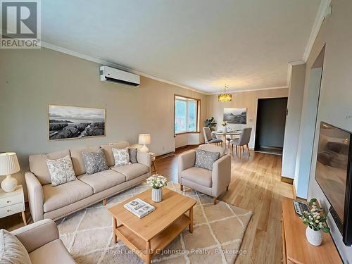 Virtually staged living room - 665 7Th Street E, Owen Sound, ON - Indoor Photo Showing Living Room