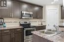 5 29 1St Avenue N, Martensville, SK  - Indoor Photo Showing Kitchen With Double Sink With Upgraded Kitchen 