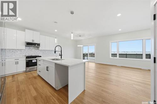 335 Sharma Crescent, Saskatoon, SK - Indoor Photo Showing Kitchen With Upgraded Kitchen