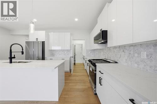 335 Sharma Crescent, Saskatoon, SK - Indoor Photo Showing Kitchen With Double Sink With Upgraded Kitchen