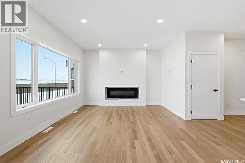 335 Sharma Crescent, Saskatoon, SK - Indoor Photo Showing Living Room With Fireplace