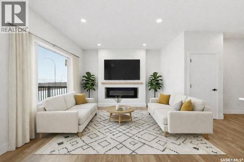 335 Sharma Crescent, Saskatoon, SK - Indoor Photo Showing Living Room With Fireplace