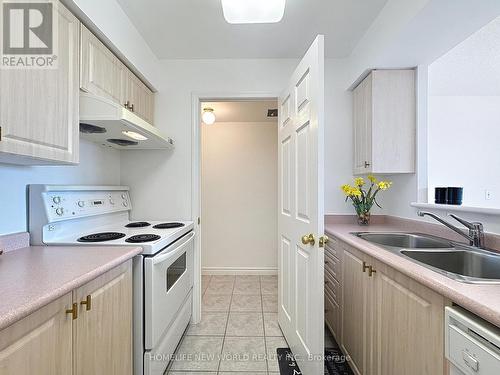 708 - 5039 Finch Avenue E, Toronto, ON - Indoor Photo Showing Kitchen With Double Sink