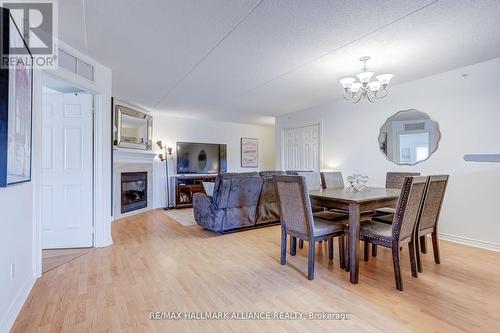 312 - 4003 Kilmer Drive, Burlington, ON - Indoor Photo Showing Dining Room With Fireplace