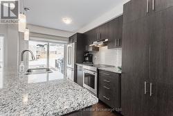 Granite Counters and Stainless Appliances - 