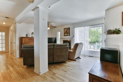 Salon - 84 Rue Onulphe-Peltier, L'Épiphanie, QC - Indoor Photo Showing Living Room With Fireplace
