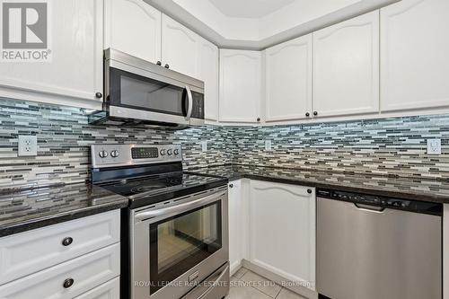 Gourmet Kitchen with a Stylish Designer Backsplash - 1324 Ashwood Terrace, Oakville, ON - Indoor Photo Showing Kitchen