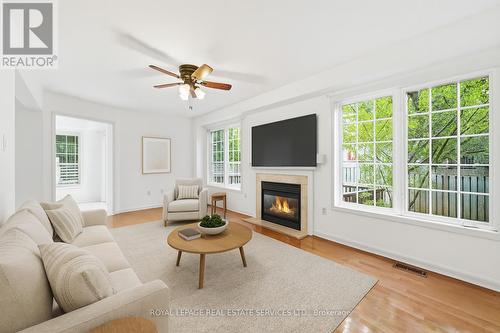 Virtually Staged Living Room with Gas Fireplace - 1324 Ashwood Terrace, Oakville, ON - Indoor Photo Showing Living Room With Fireplace