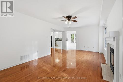 Living Room with Hardwood Flooring & Gas Fireplace - 1324 Ashwood Terrace, Oakville, ON - Indoor Photo Showing Other Room With Fireplace