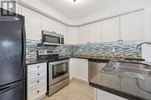 Gourmet Kitchen with a Stylish Designer Backsplash - 1324 Ashwood Terrace, Oakville, ON - Indoor Photo Showing Kitchen With Double Sink With Upgraded Kitchen
