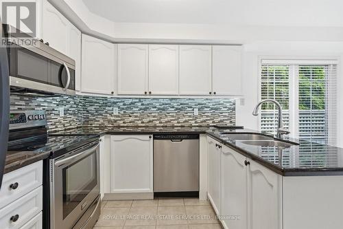 Gourmet Kitchen Features Granite Countertops - 1324 Ashwood Terrace, Oakville, ON - Indoor Photo Showing Kitchen With Double Sink With Upgraded Kitchen