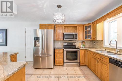 21 Maryjane Road, Tiny, ON - Indoor Photo Showing Kitchen With Double Sink
