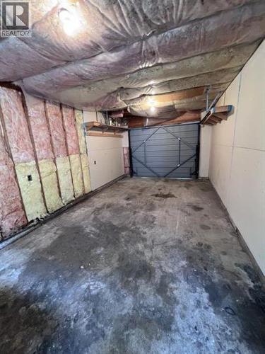 84 5550 Simpson Trail, Fort Nelson, BC - Indoor Photo Showing Garage