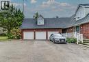 View of front of home with roof with shingles, brick siding, and dirt driveway - 685 Briardean Road Unit# Lower, Cambridge, ON  - Outdoor 