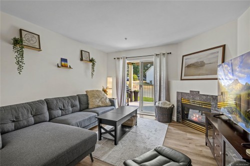 204-4971 Songbird Pl, Nanaimo, BC - Indoor Photo Showing Living Room With Fireplace
