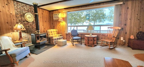 117 Clifford Drive, Kawartha Lakes, ON - Indoor Photo Showing Other Room With Fireplace