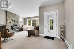 Living room with wood burning fireplace - 