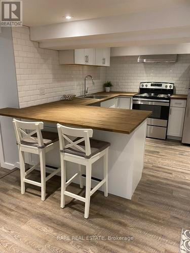 2491 Gerrard Street E, Toronto, ON - Indoor Photo Showing Kitchen With Double Sink