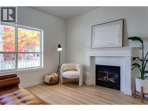 Cozy gas fireplace - 388 Mccarren Avenue, Kelowna, BC - Indoor Photo Showing Living Room With Fireplace