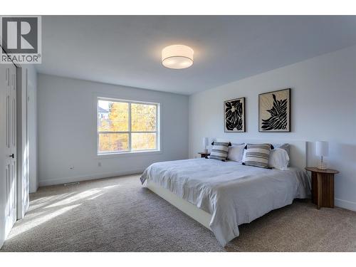 Primary Bedroom - 388 Mccarren Avenue, Kelowna, BC - Indoor Photo Showing Bedroom