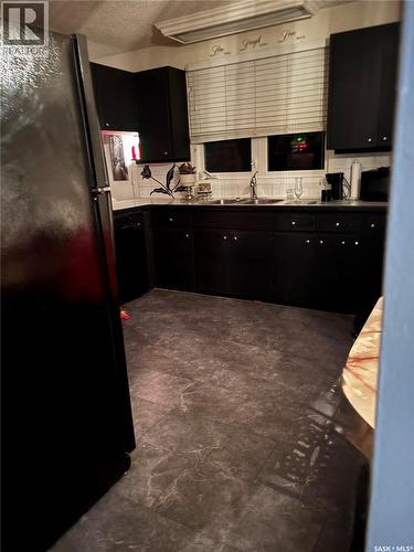 216 Ash Drive, Weyburn, SK - Indoor Photo Showing Kitchen With Double Sink