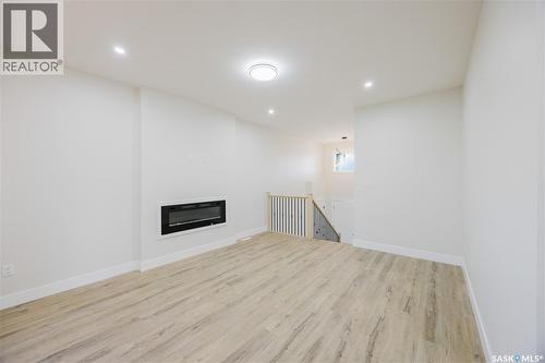 438 Stromberg Crescent, Saskatoon, SK - Indoor Photo Showing Other Room With Fireplace