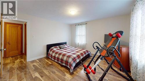 Bedroom with wood finished floors and baseboards - 113 Edmund Road, Kitchener, ON - Indoor Photo Showing Bedroom