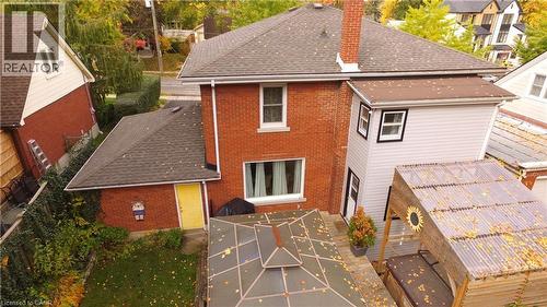 Rear view of property with a chimney, roof with shingles, and brick siding - 113 Edmund Road, Kitchener, ON - Outdoor With Exterior