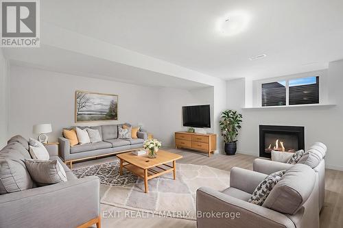 937 Cologne Street, Russell, ON - Indoor Photo Showing Living Room With Fireplace