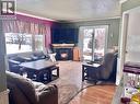 Campbell Acreage 12Kms South, Meadow Lake, SK  - Indoor Photo Showing Living Room With Fireplace 