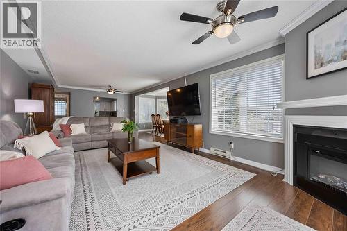 1520 Venetian Boulevard Unit# M101, Point Edward, ON - Indoor Photo Showing Living Room With Fireplace