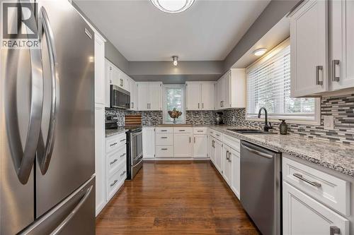 1520 Venetian Boulevard Unit# M101, Point Edward, ON - Indoor Photo Showing Kitchen With Upgraded Kitchen