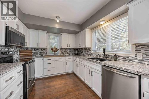 1520 Venetian Boulevard Unit# M101, Point Edward, ON - Indoor Photo Showing Kitchen With Double Sink With Upgraded Kitchen