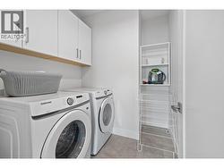 A Full Laundry with Side By Side PLUS Cabinets - 
