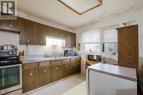 1055 Jasmine Road, Kelowna, BC - Indoor Photo Showing Kitchen With Double Sink