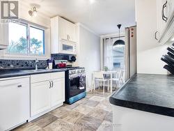 Eat in kitchen with stainless appliances - 