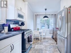 Eat in kitchen with stainless appliances - 