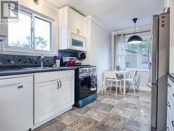 Eat in kitchen with stainless appliances - 