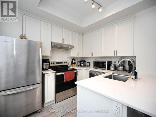 #338 - 349 Wheat Boom Drive, Oakville, ON - Indoor Photo Showing Kitchen With Stainless Steel Kitchen