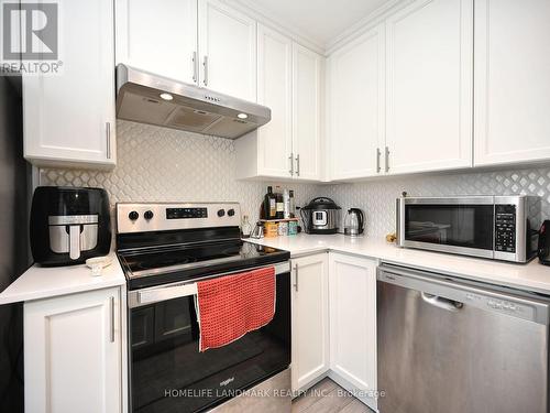 #338 - 349 Wheat Boom Drive, Oakville, ON - Indoor Photo Showing Kitchen With Stainless Steel Kitchen